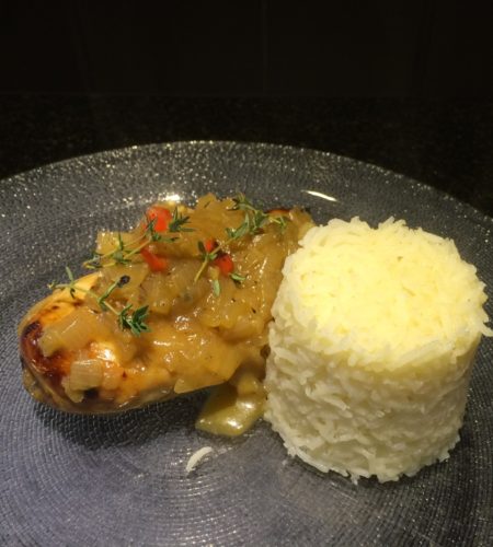 Poulet Yassa is one of Senegals most popular dishes which features lemon-marinated grilled chicken simmered in a spicy onion sauce.