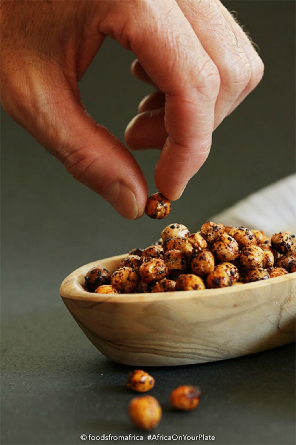 These Oven-roasted Chickpeas are the ultimate healthy snack - black-speckled golden and crispy balls with a buttery interior and a spicy kick