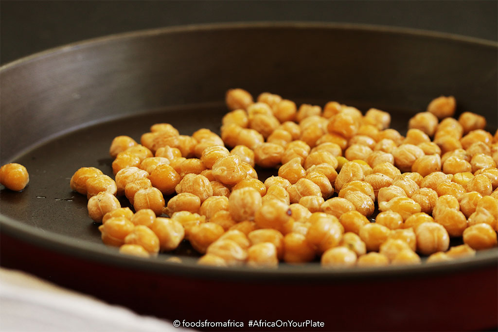 These Oven-roasted Chickpeas are the ultimate healthy snack - black-speckled golden and crispy balls with a buttery interior and a spicy kick