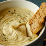 In this post, I share the secret to making the most awesome hummus dip, from an Algerian recipe. This Algerian Hummus recipe delivers the most silky smooth and creamy hummus dip.