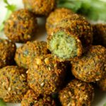 This Moroccan-inspired falafel recipe delivers a delicately crispy falafel on the outside with a soft buttery interior. Herbed and spiced to perfection, they are super easy to make. Eat them on their own, or in a falafel salad or as a snack.